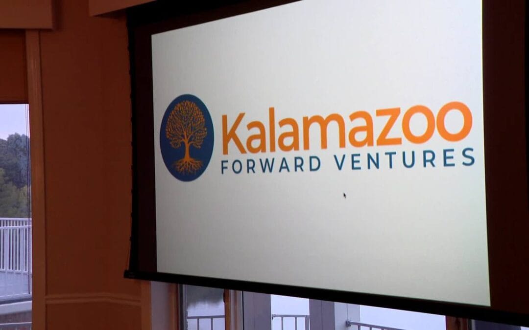 Kalamazoo Forward Ventures logo displayed on a presentation screen Kalamazoo Forward Ventures logo displayed on a presentation screen